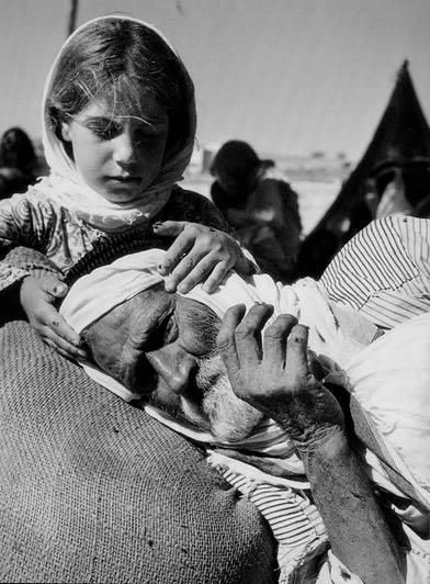 Young Palestinian girl consoling her refugee dad during displacement of Nakba in 1948