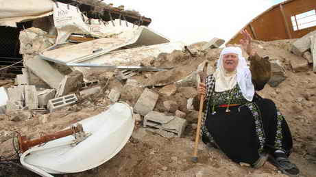 Old Palestinian woman despairing for her house demolished by Israeli soldiers