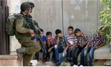 Palestinian children held by Israeli soldiers
