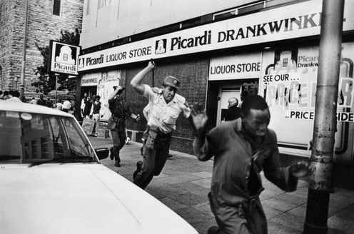 South Africa police attacking black native worker